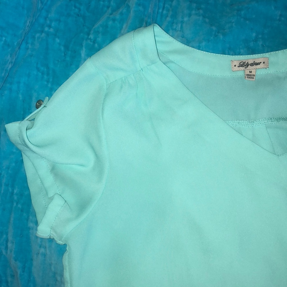 Turquoise colored blouse